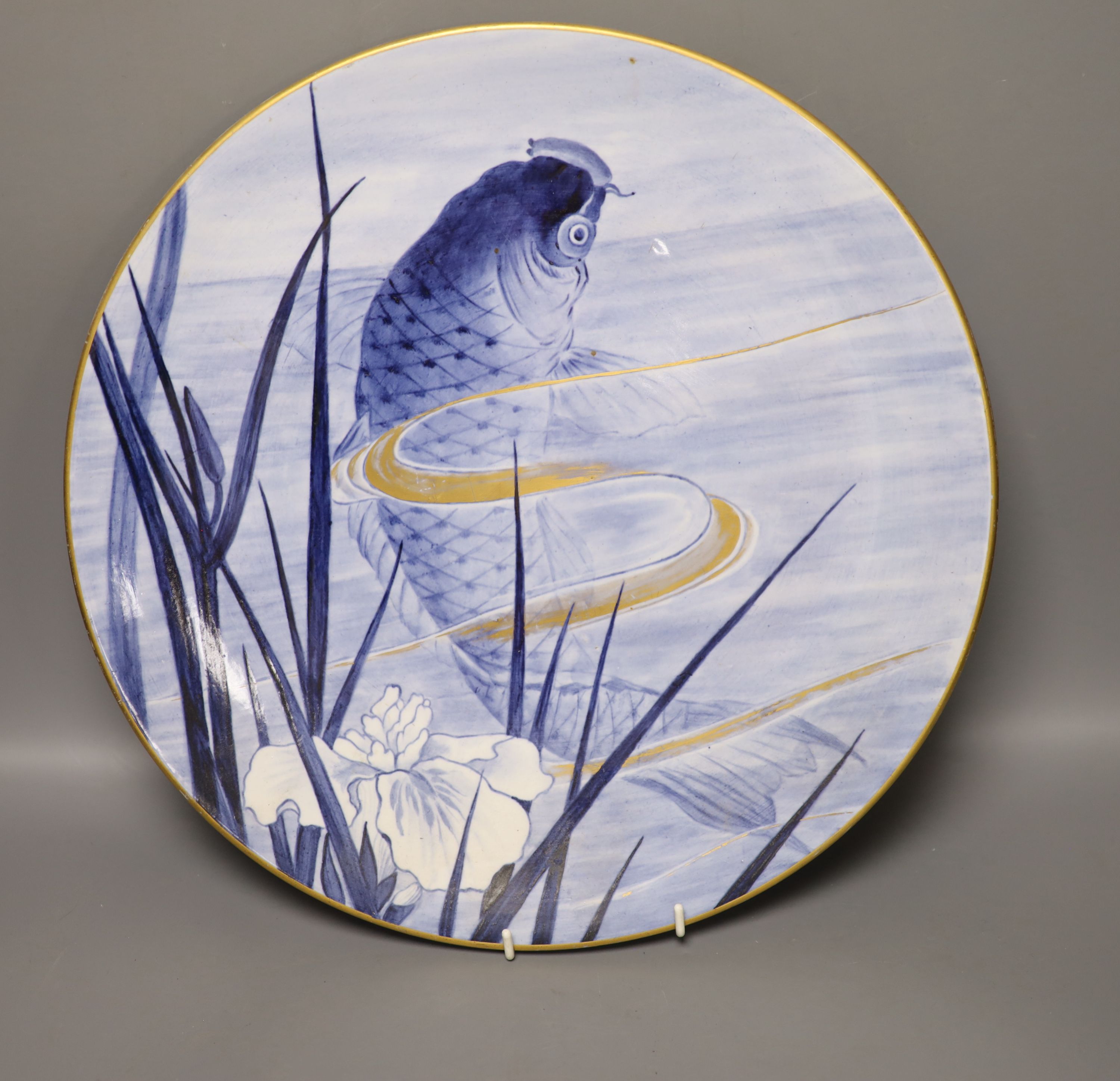 A Royal Worcester Aesthetic period circular plaque, decorated with a carp, diameter 36cm